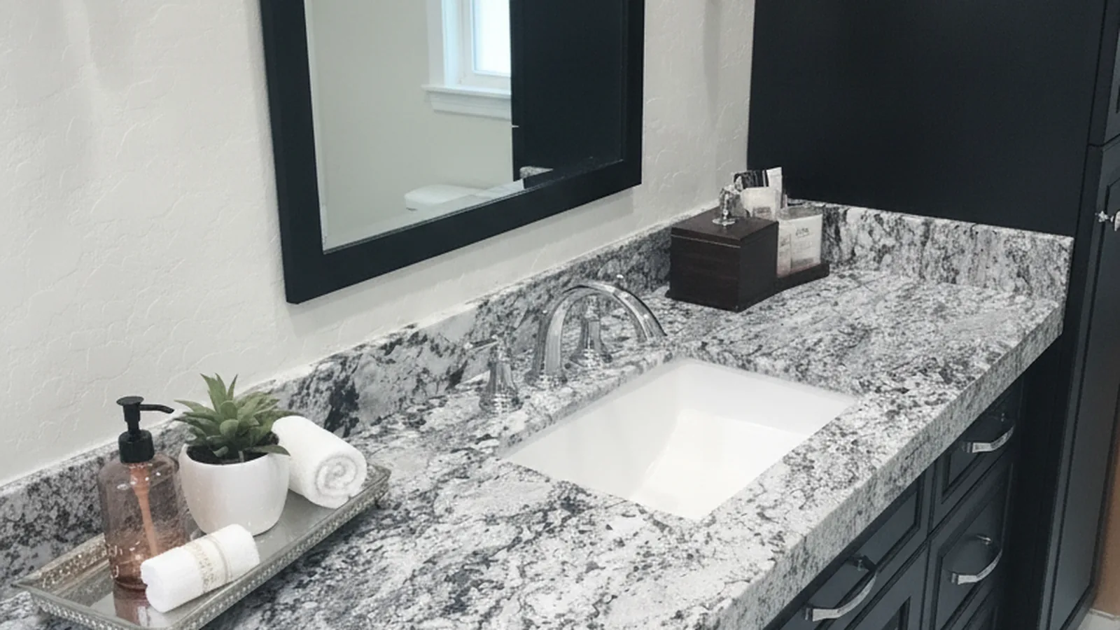 Bathroom vanity with a stone remnant countertop being measured in a Phoenix fabrication shop