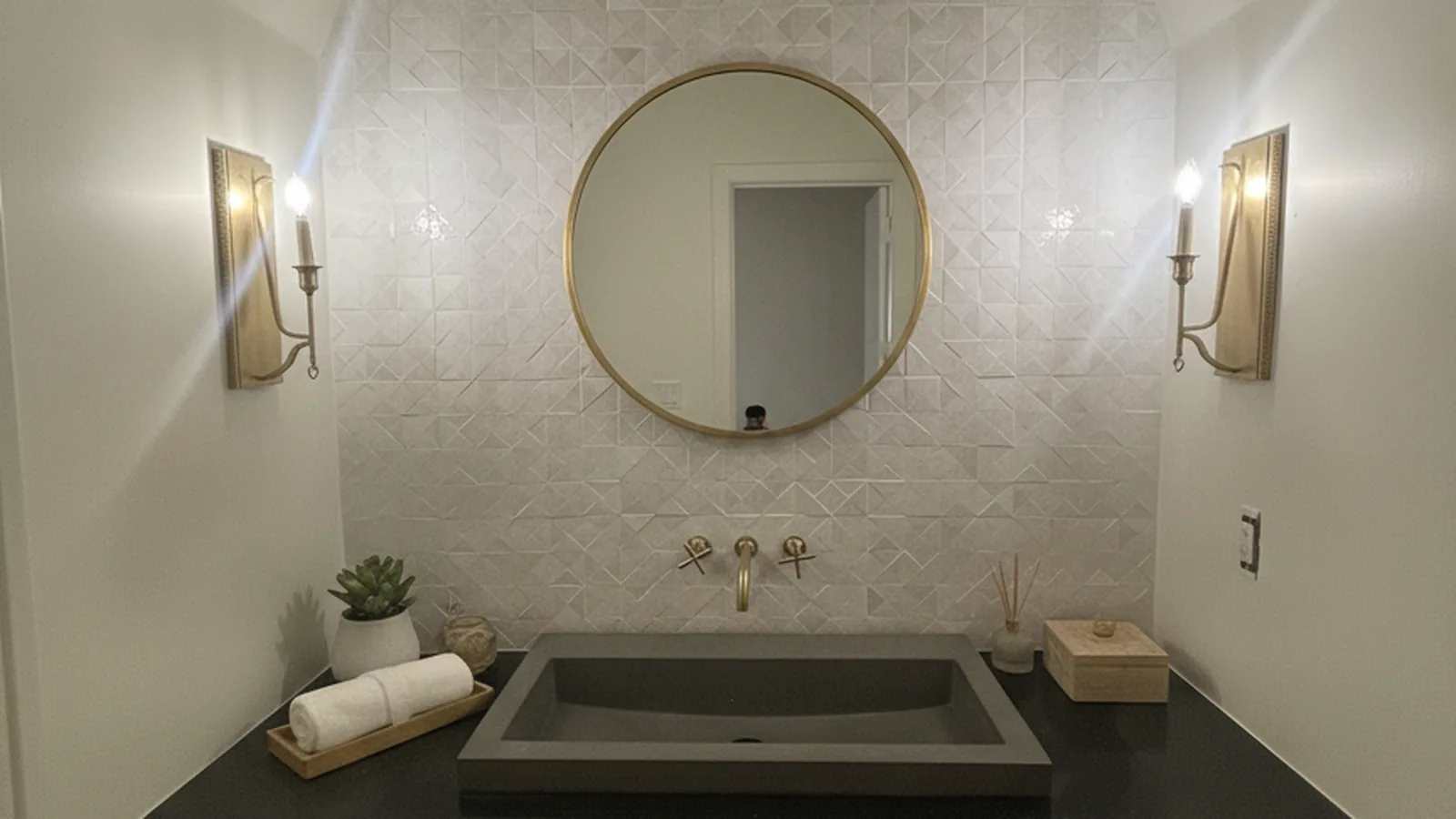 Large-format porcelain shower wall with a stone niche and bench in an Arizona home